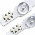 Samsung UN40HU6950 backlight strip connector detail showing positive and negative terminals beside LED lenses